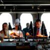 Business professionals enjoying a buffet meal in a contemporary indoor restaurant setting.