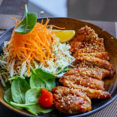 Vibrant Asian salad with grilled chicken, perfect for healthy eating enthusiasts.